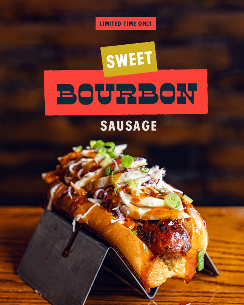 Sweet Bourbon Sausage topped with crisp apple slaw and spicy bourbon glaze on Boonedogs signature bun
